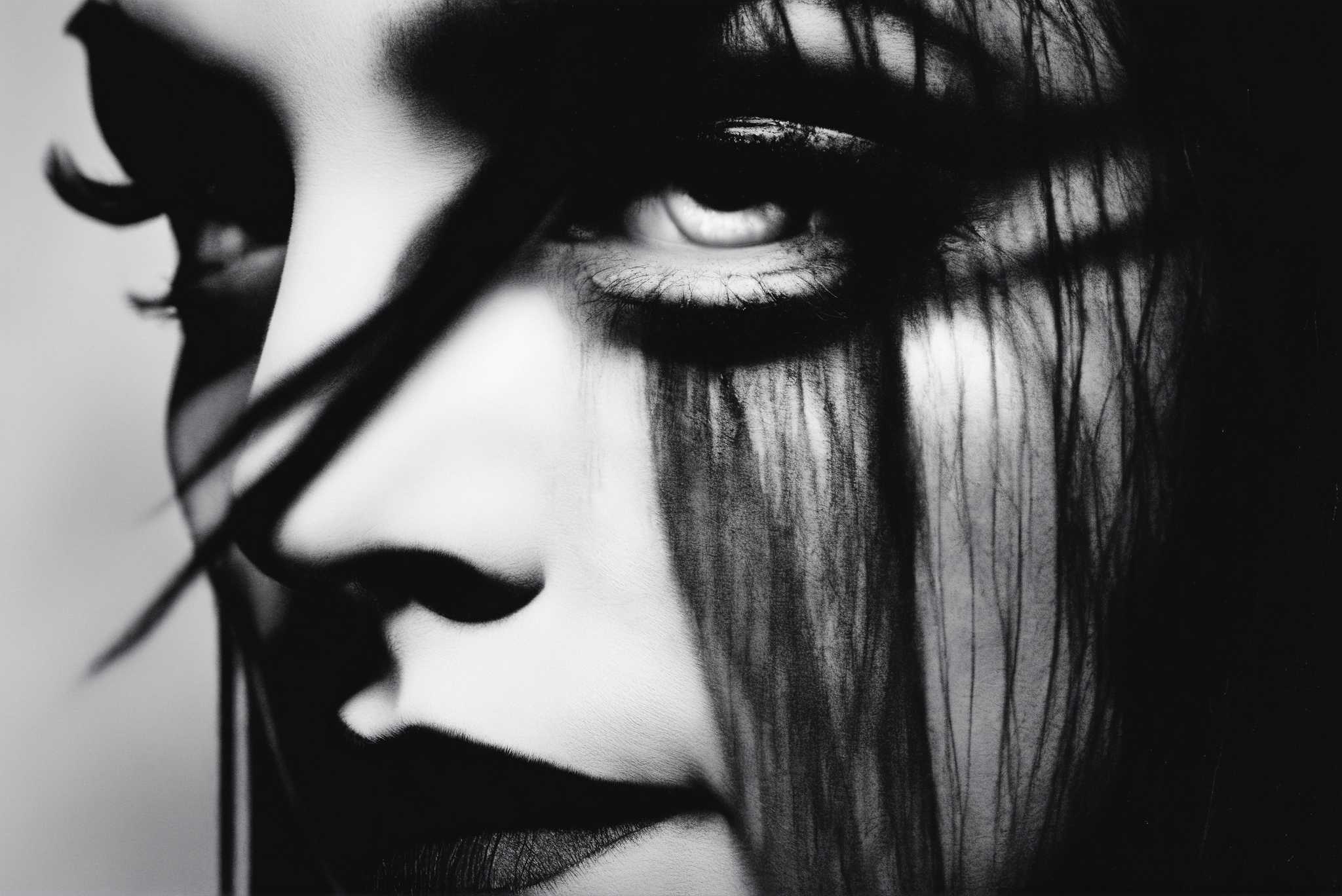 Gaze of the sable enchantress: Dramatic eye art with captivating eye portraits, in a room with chic decor, digital art pieces, and trendy home accents. The art can be printed on poster, framed poster, canvas, metal, acrylic or wood, exclusively at WallArtZen. Find this exact print at https://wallartzen.com/waz191