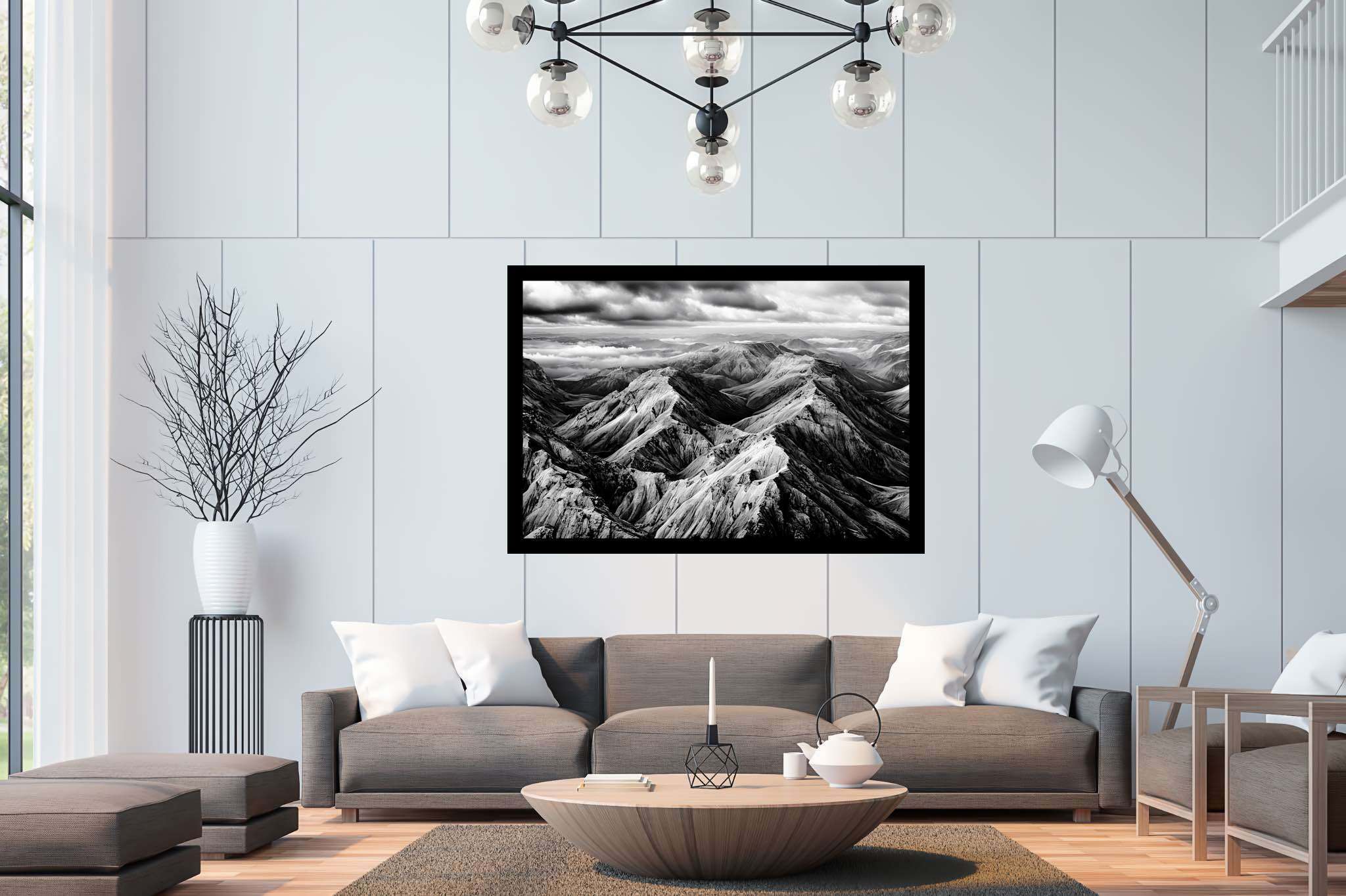 Veiled peaks serenade: Captivating aerial landscape art with mesmerizing aerial views, in a room with urban design, gallery-quality artwork, and trendy home accents. The art can be printed on poster, framed poster, canvas, metal, acrylic or wood, exclusively at WallArtZen. Find this exact print at https://wallartzen.com/waz125