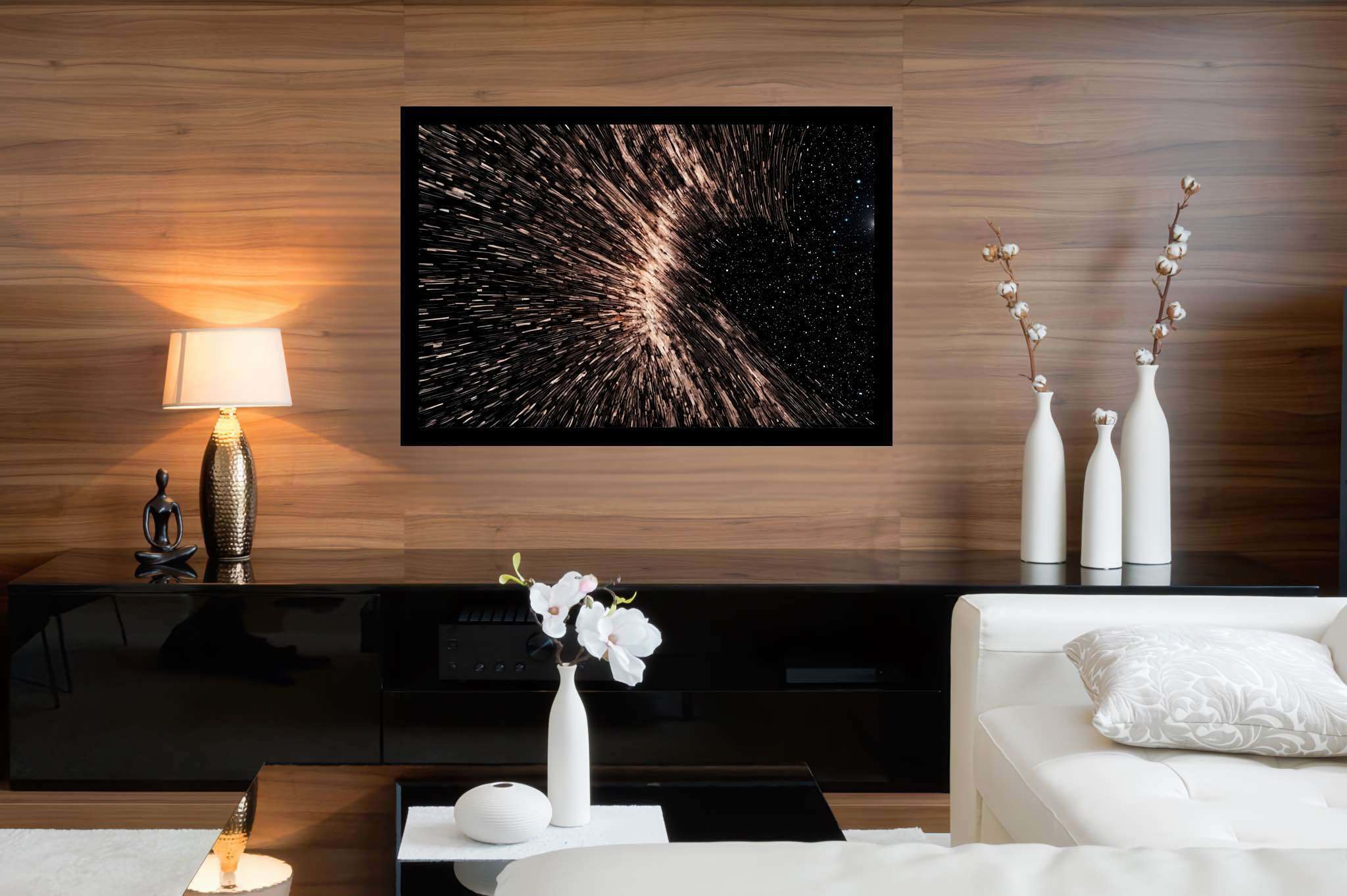 Galactic embrace: Stunning black hole art with mesmerizing astrophotography, in a room with great design, abstract paintings, and trendy home accents. The art can be printed on poster, framed poster, canvas, metal, acrylic or wood, exclusively at WallArtZen. Find this exact print at https://wallartzen.com/waz321